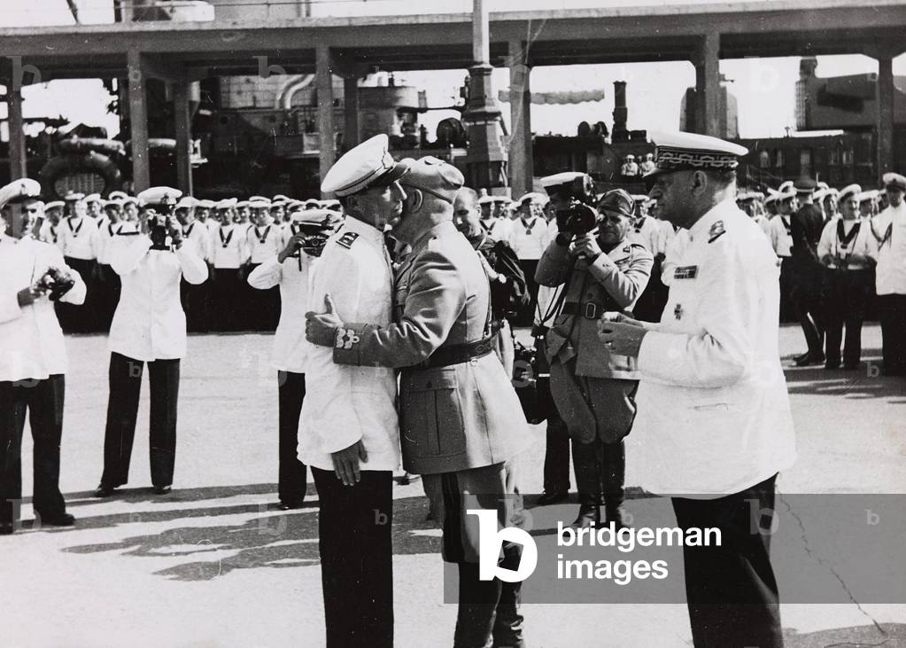 After the Battle of Pantelleria Benito Mussolini embraces a heroic officer of the Royal Navy (b/w photo)