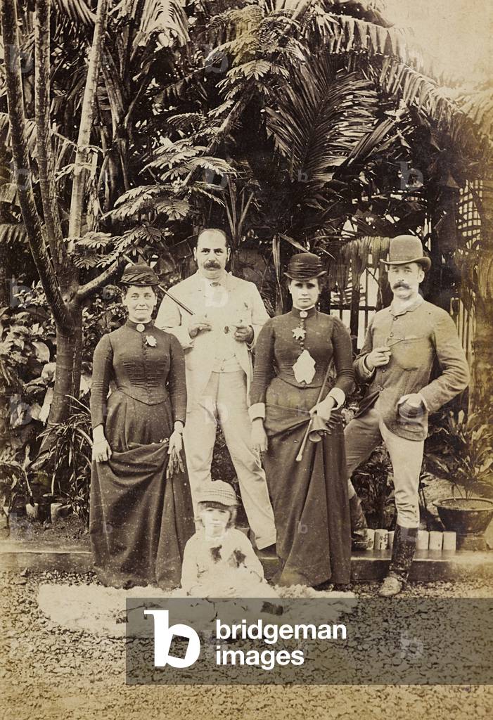 Portrait of a British family in the garden of his villa in China