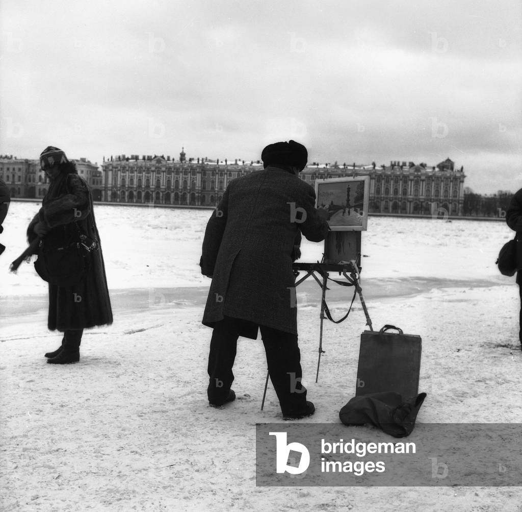 Painter in a square in St. Petersburg with snow (b/w photo)
