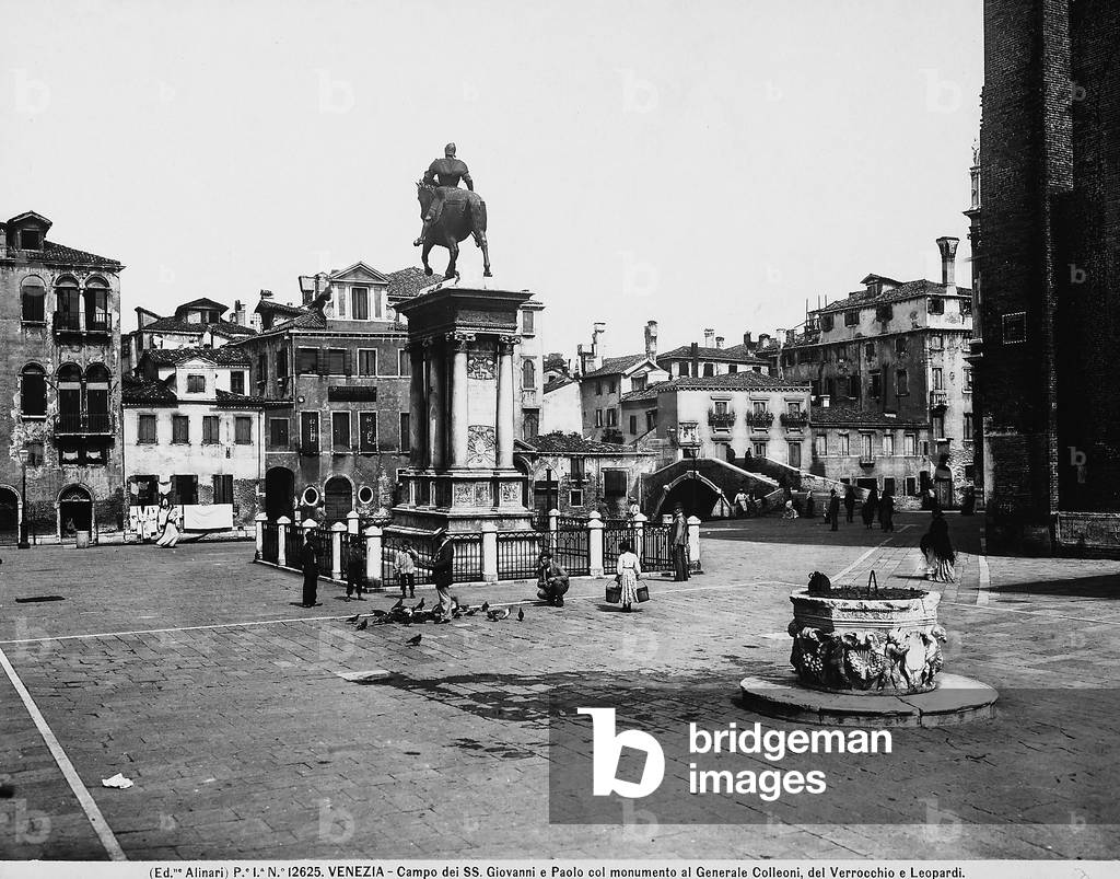 The Campo dei Santi Giovanni e Paolo, in Venice, with, in its center, the equestrian monument of Bartolomeo Colleoni, by Verrocchio. In the foreground, a well curb