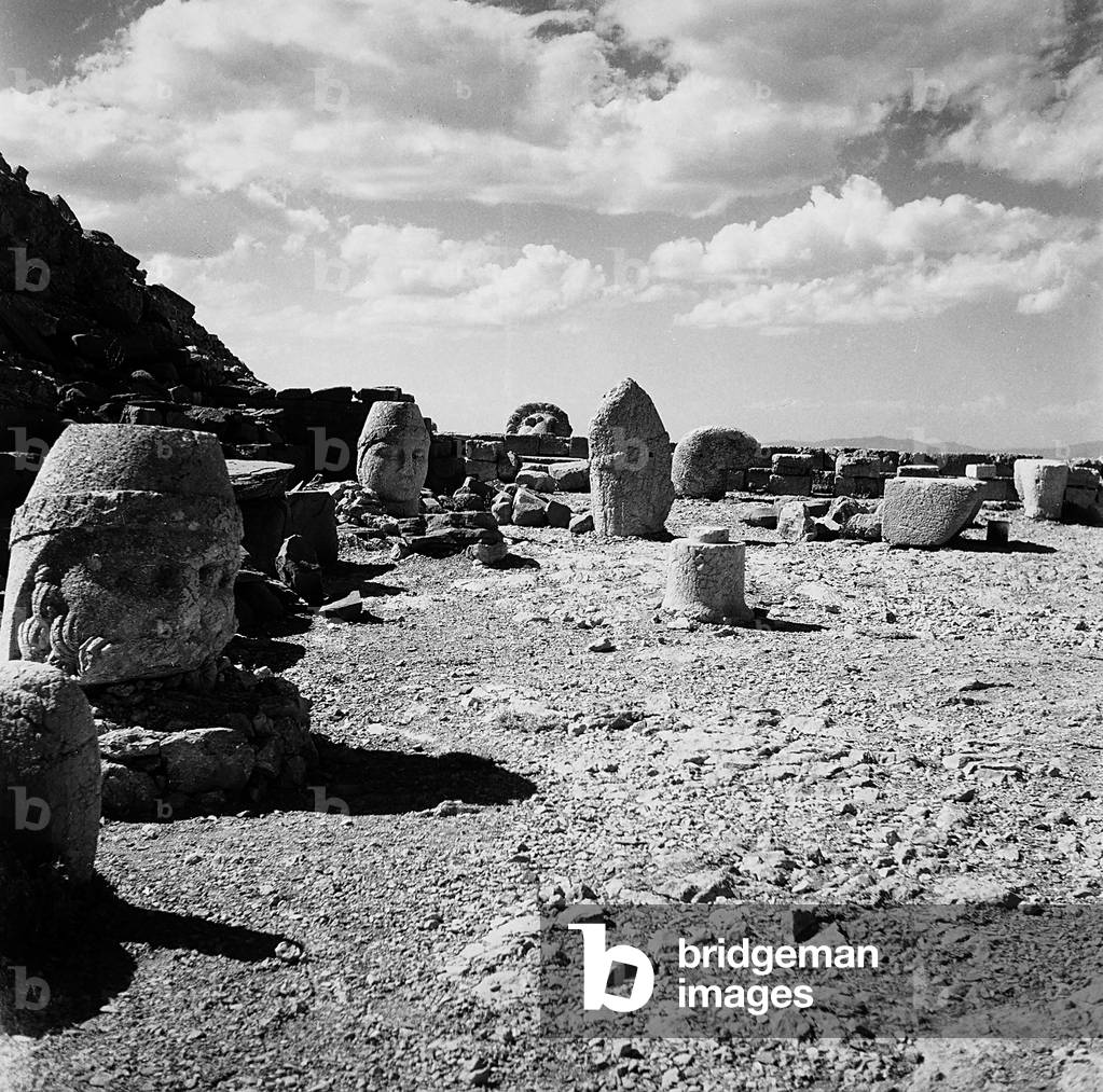 Sculpted heads, remains of the colossal statues from the Tomb of Antiochus I, on the summit of Nemrut Dagi
