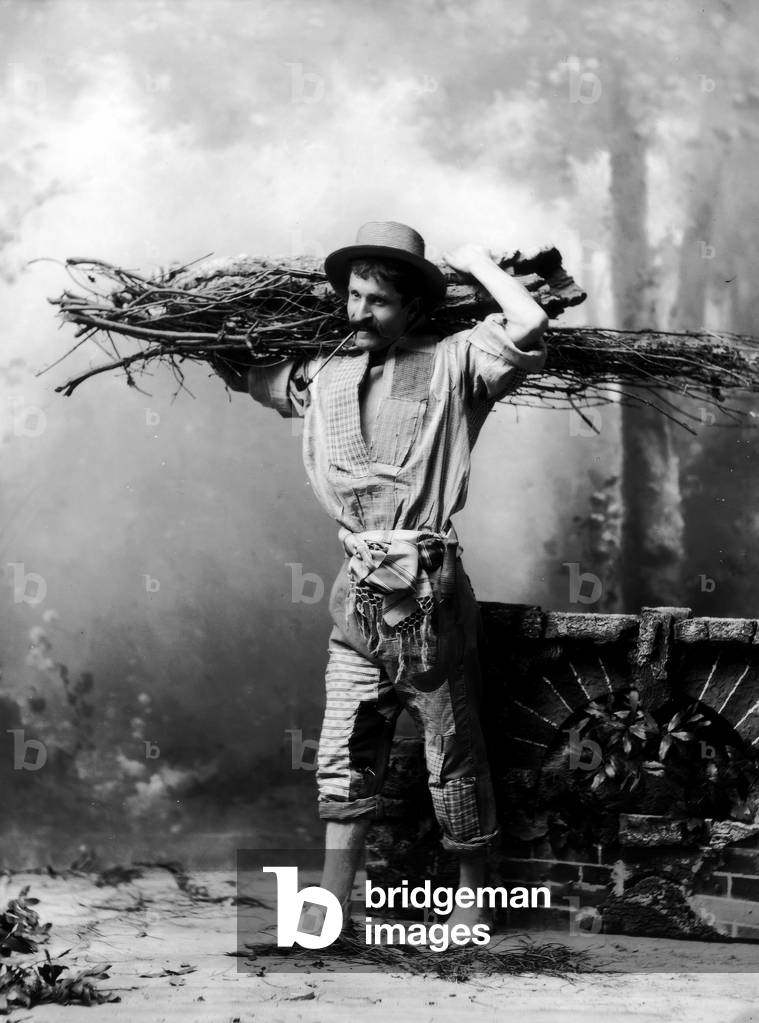 Farmer with a bundle on his shoulders