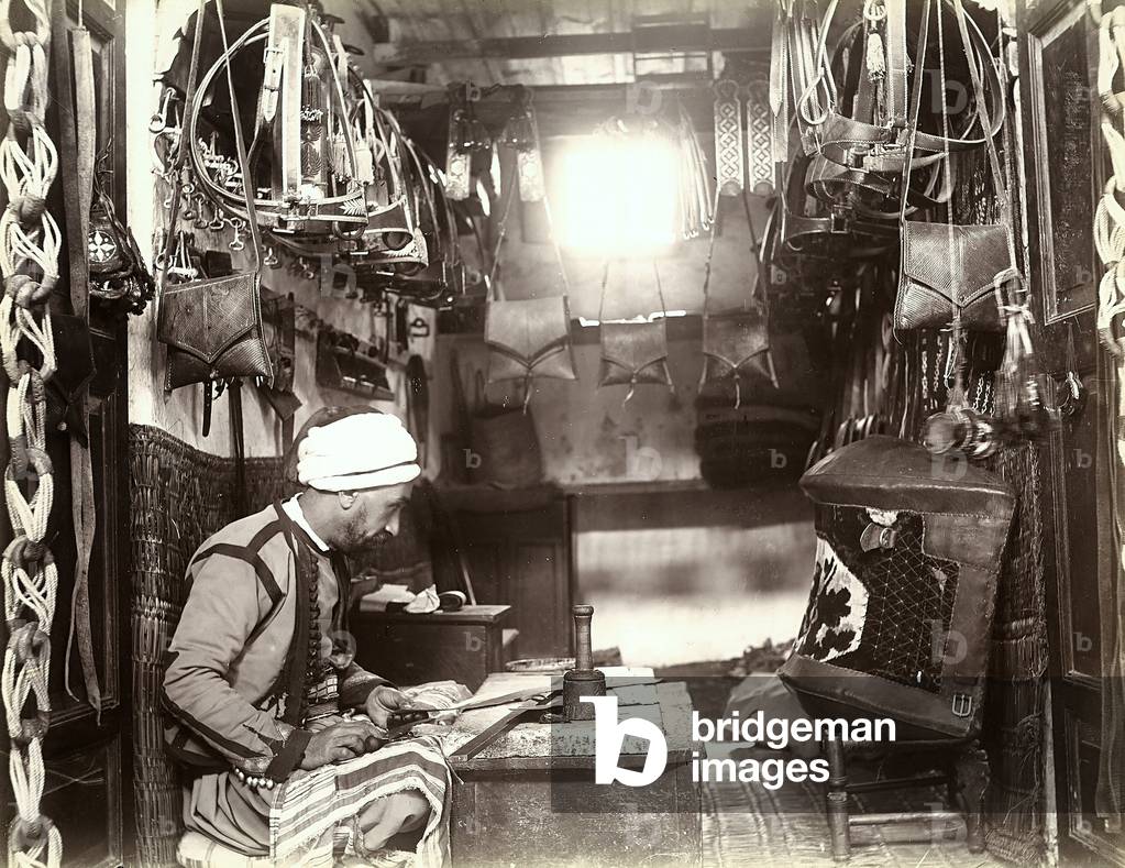 A Turkish artisan making an object out of leather in his shop, 1890 (print on double-weight paper)