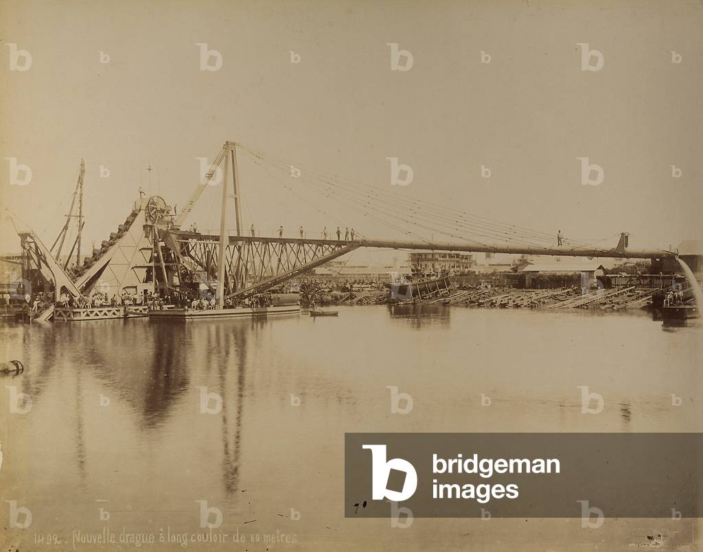 A dredging machine with a long-reach arm at work on the river. Egypt