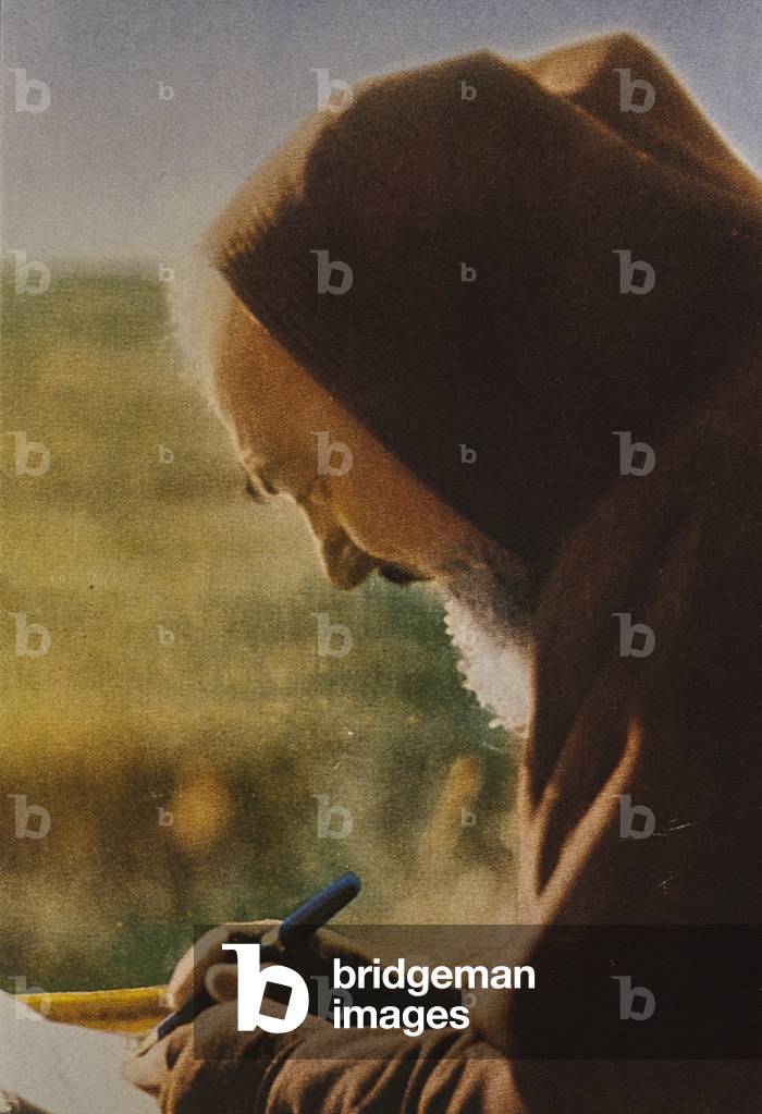 Portrait of Padre Pio (1887-1968) while writing