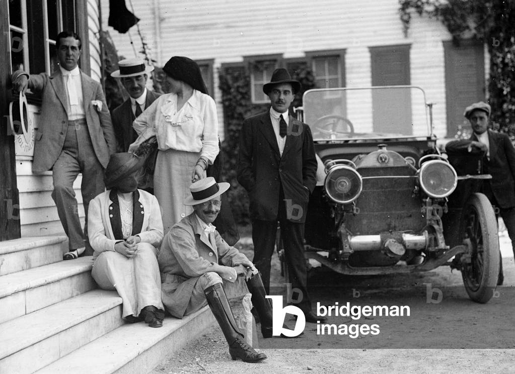 Group portrait beside a car, Tyndareus