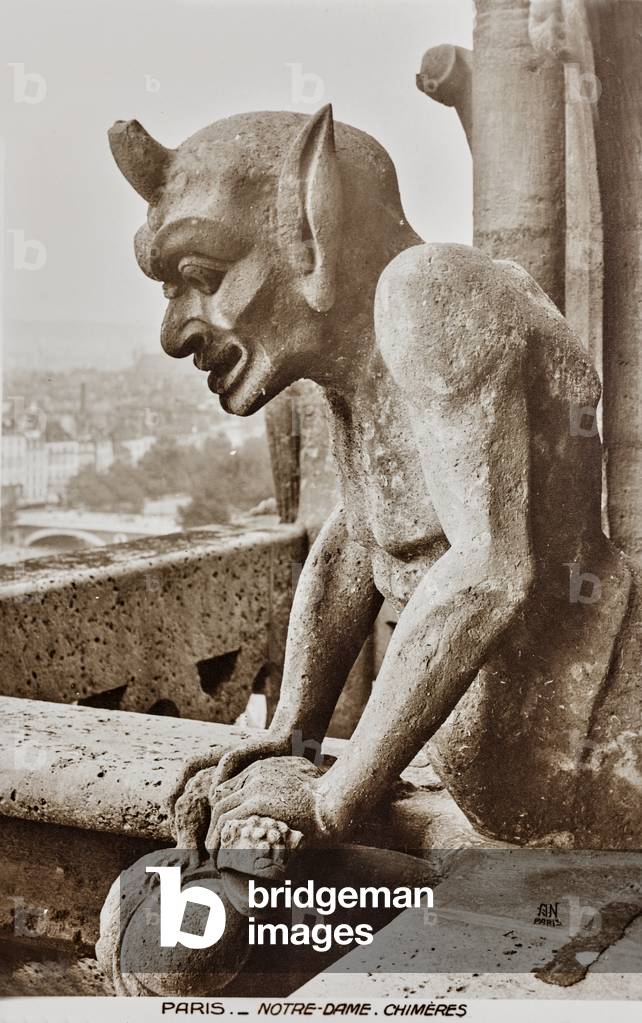 Chimera crowned by a balustrade of the Notre-Dame cathedral in Paris