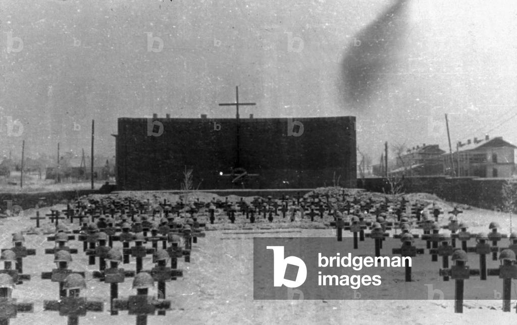 Lines of crosses mark graves in the military cemetery of Ricovo in Russia.