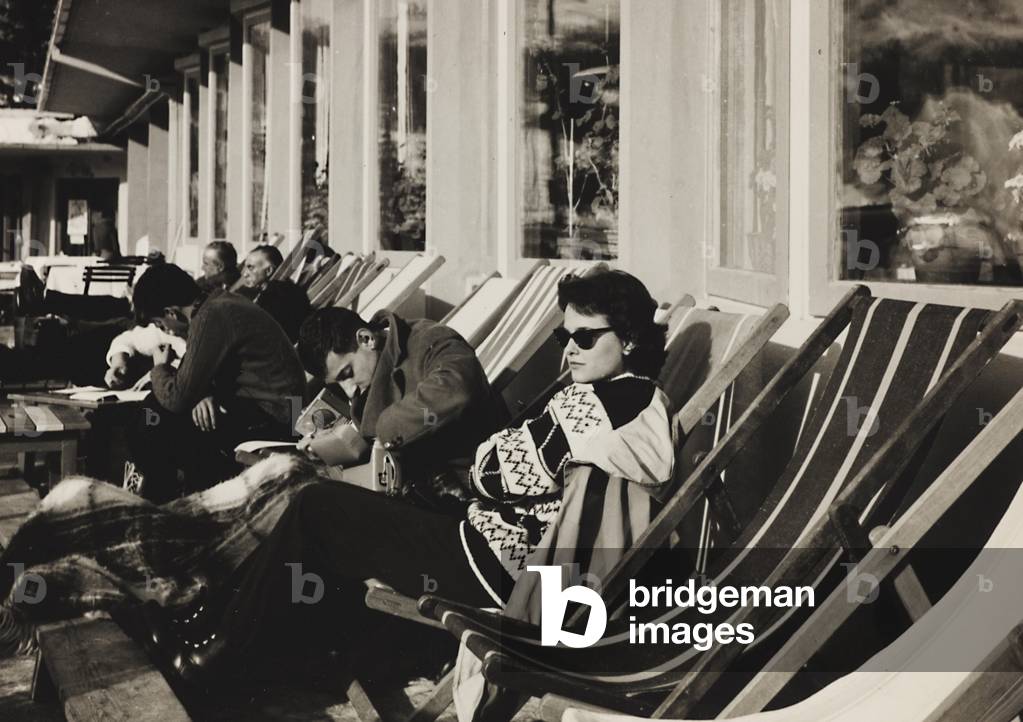 Group sunning in deck chairs, Cortina d'Ampezzo