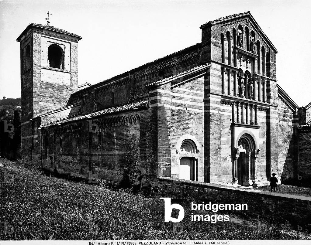 The façade and a side of the bell tower of the Abbey of Vezzolano, near Asti, in Piemonte.