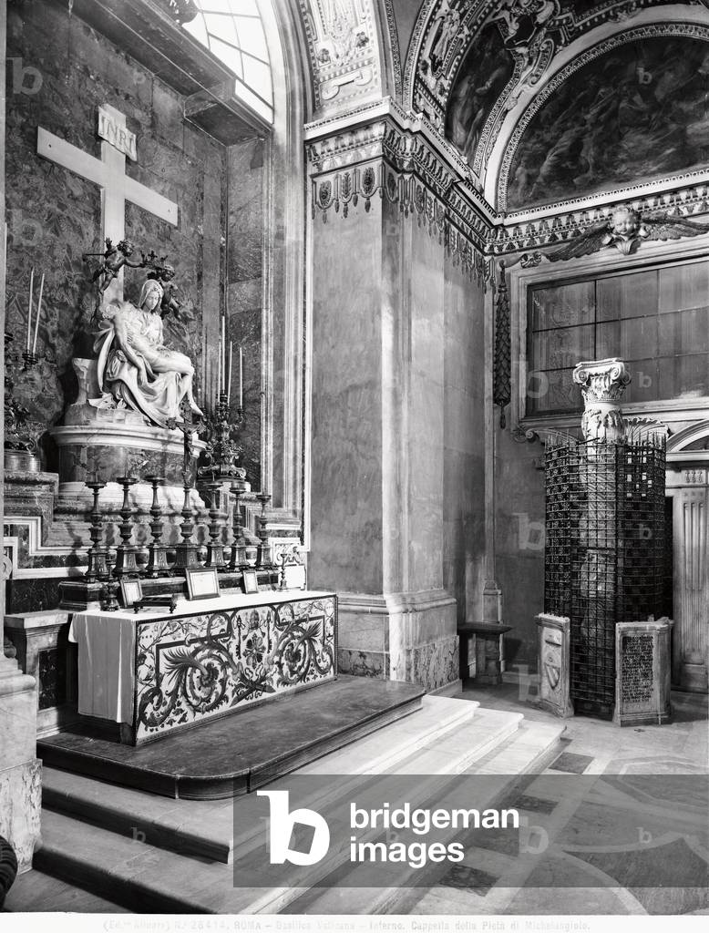 View of the Cappella della Pietà with the famous Pietà by Michelangelo Buonarroti and, on the left, the column decorated with bas-relief grapevine.  According to tradition, Jesus leaned back against this column in the Solomon's Temple in Jerusalem. Basilica of S. Pietro, Vatican City