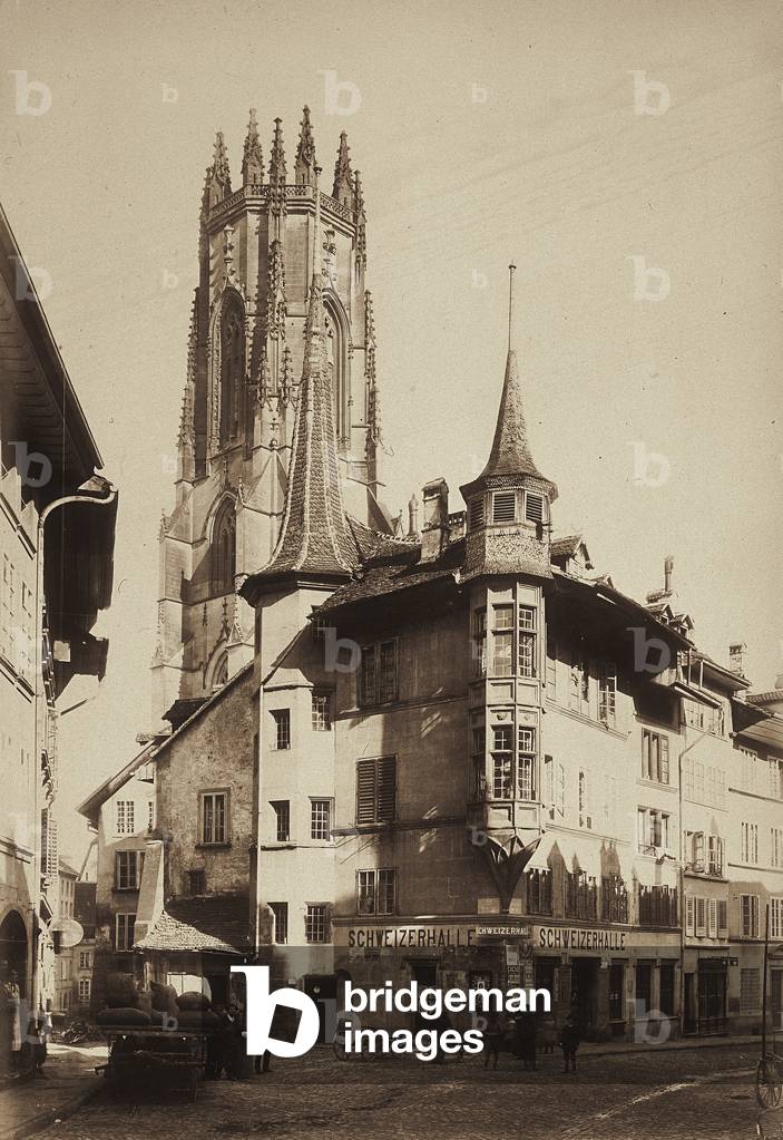 The central street of Freiburg, with the bell tower of the cathedral