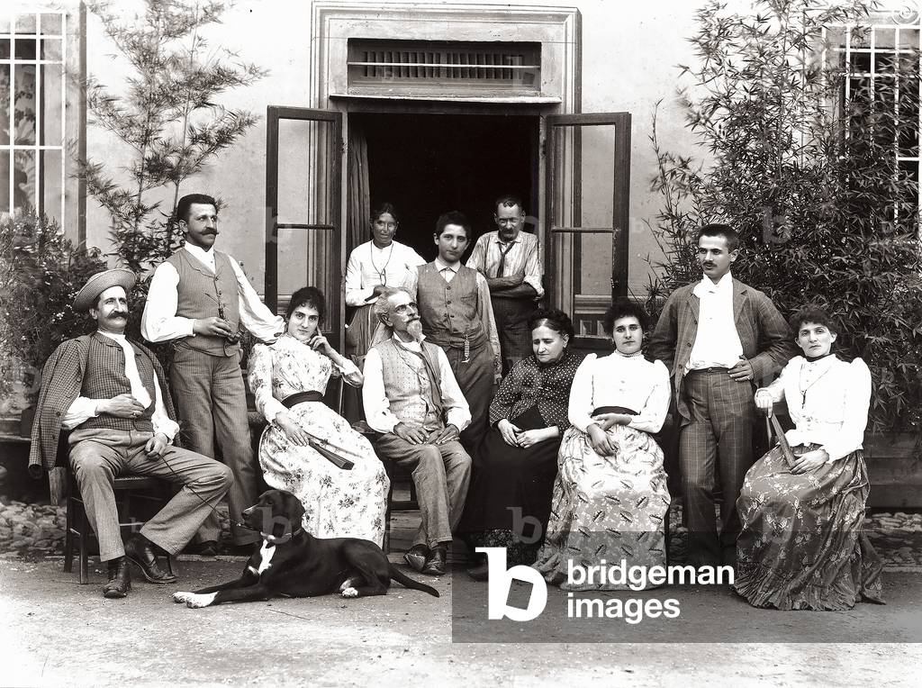Group portrait of the Rossini family, in front of their home