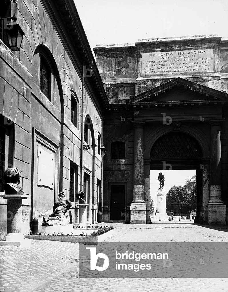 The exterior façade of the Porta Pia, in Rome, 19th century structure by Verginio Vespignani. The Monument to the Bersagliere is visible in the background