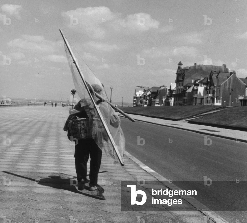 Fisherman on the seafront in Le Touquet (b/w photo)