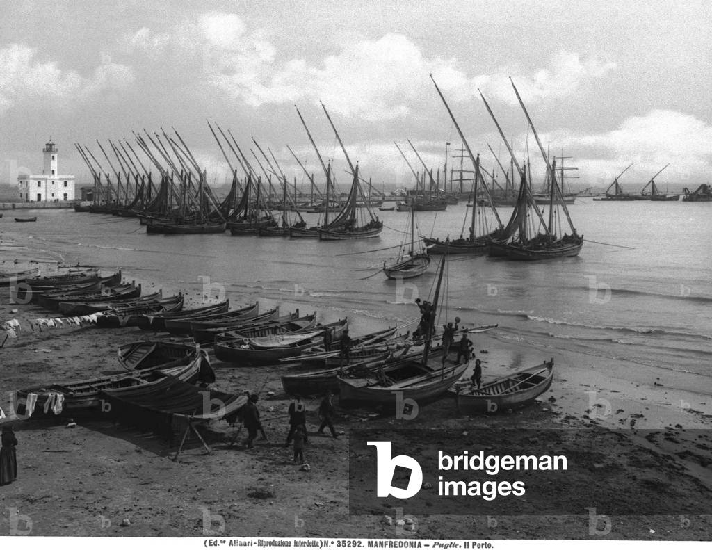 The port of Manfredonia dotted with boats lying at anchor
