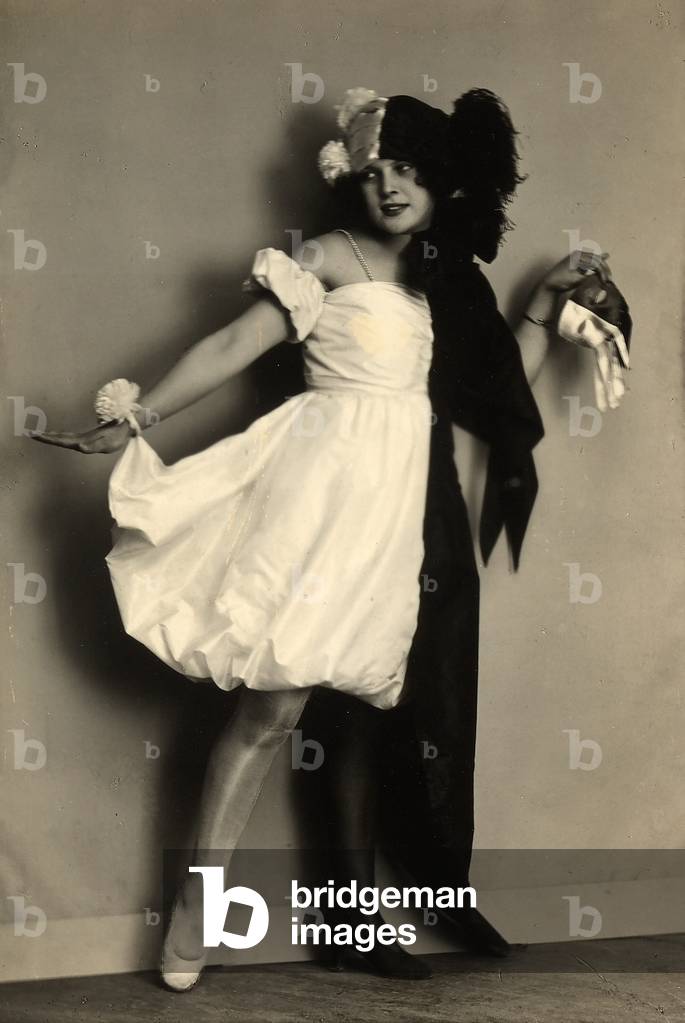Portrait of Wanda Wulz dressed up with a costume (b/w photo)