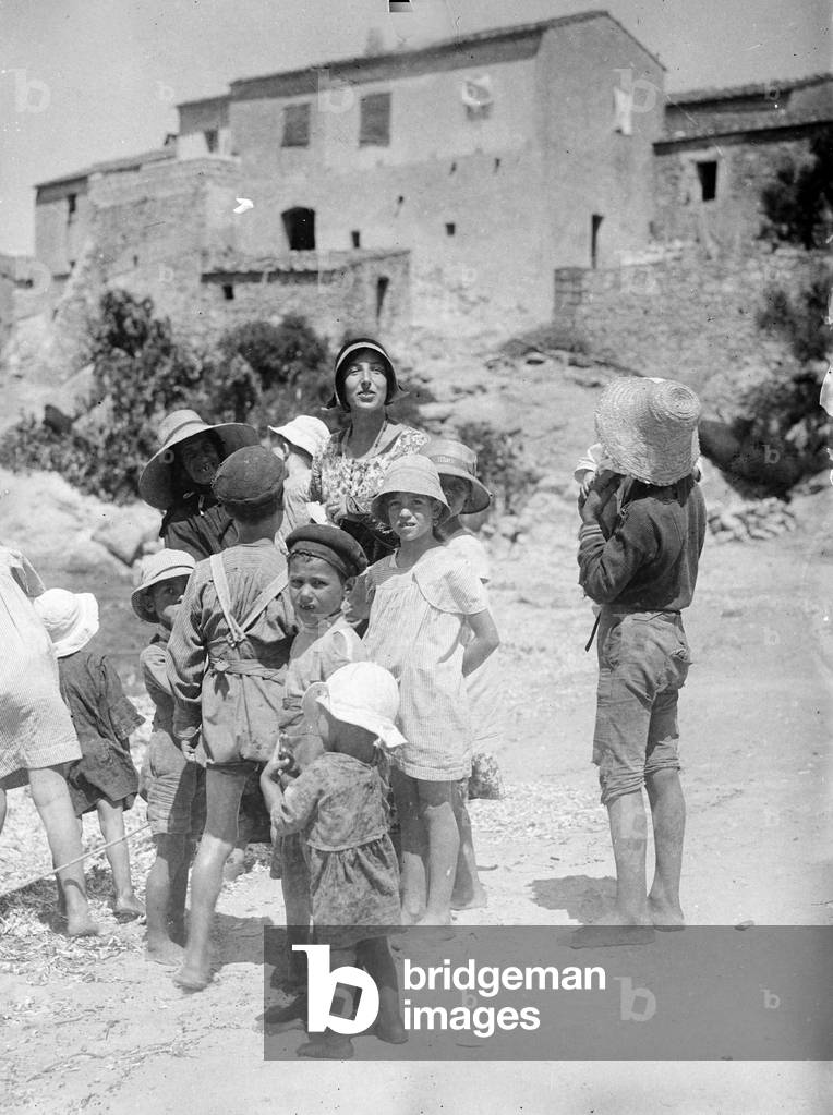 Group of children on a beach in Tuscany (b/w photo)