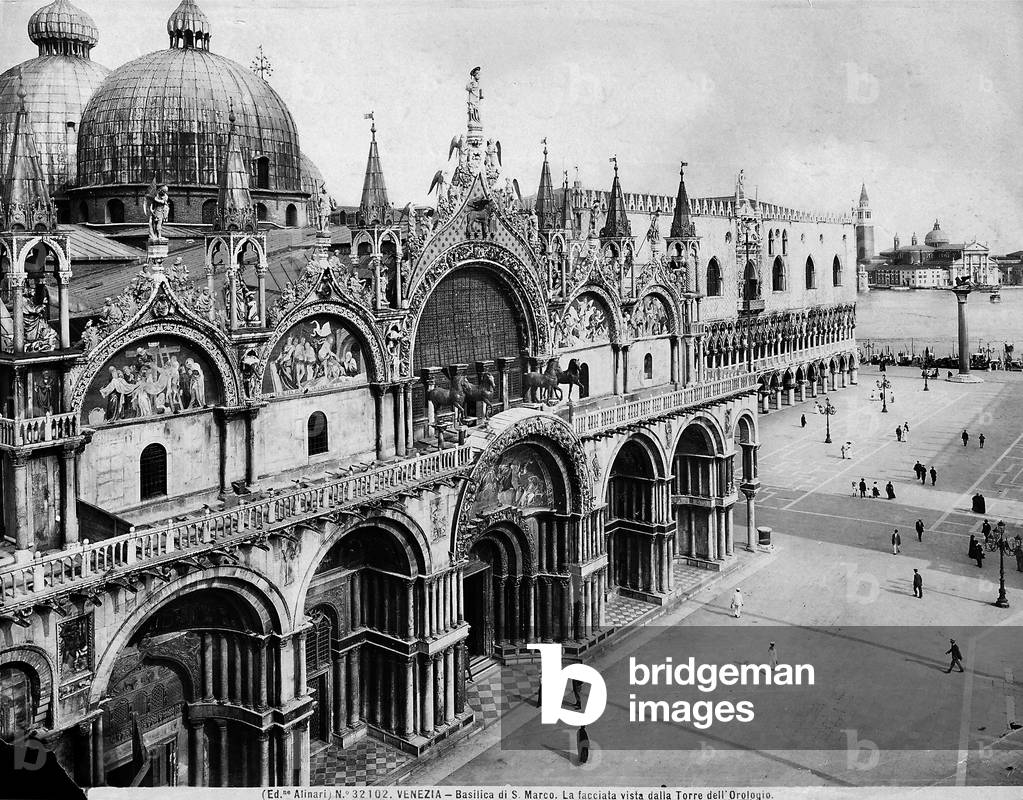 Façade of St. Mark's Basilica in Venice. The Doge's Palace can be glimpsed in the background