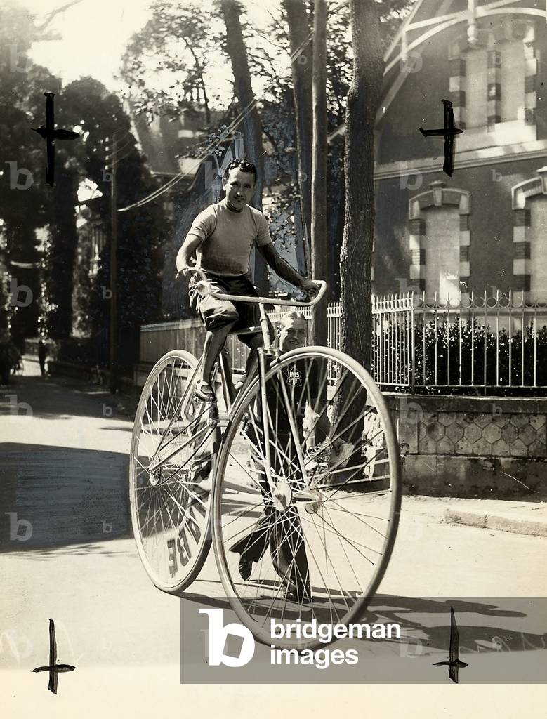 Athlete on a gigantic bicycle