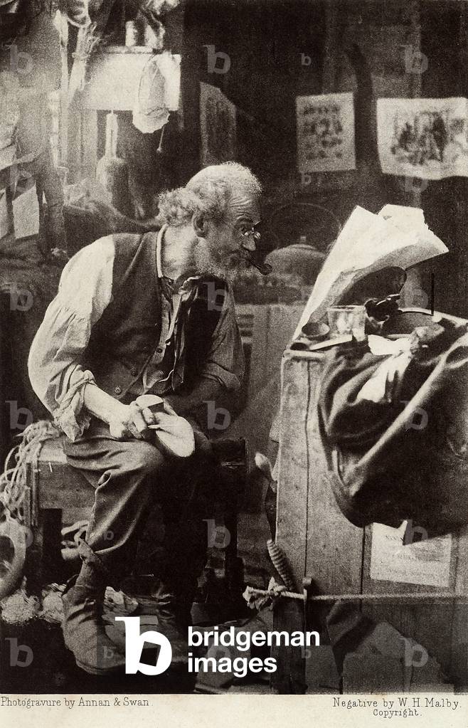A shoemaker reading the newspaper