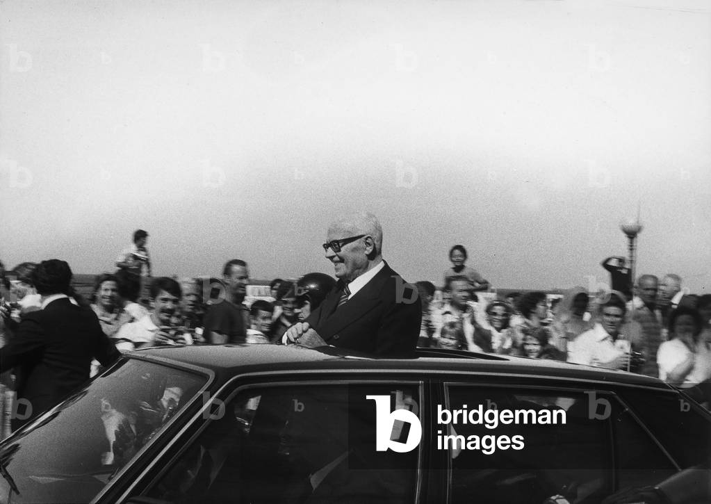 The Presdient of the Republic, Sandro Pertini, smiling at the crowd during an official visit