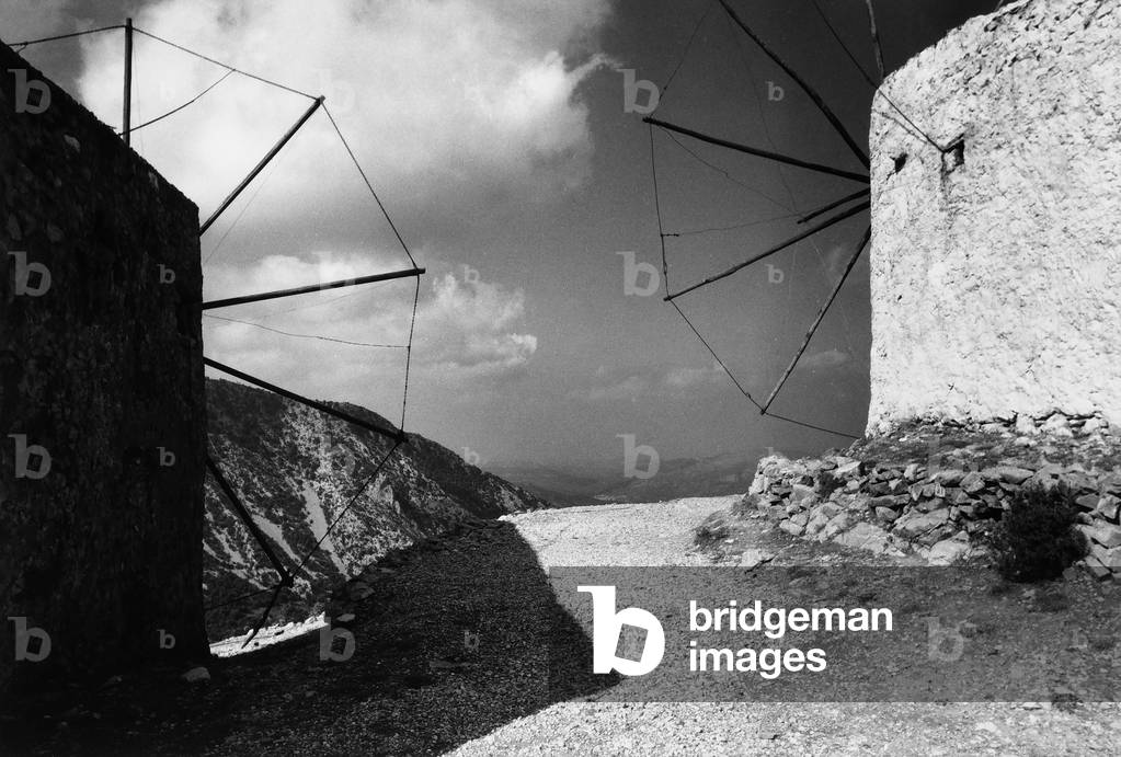Two windmills on the mountains of Crete (b/w photo)