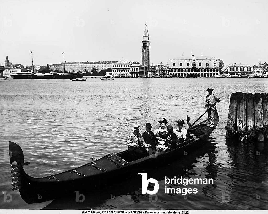 Panorama of Venice from the Grand Canal. In the foreground, a gondola with people aboard; in the background, the Doge's Palace and St. Mark's belltower
