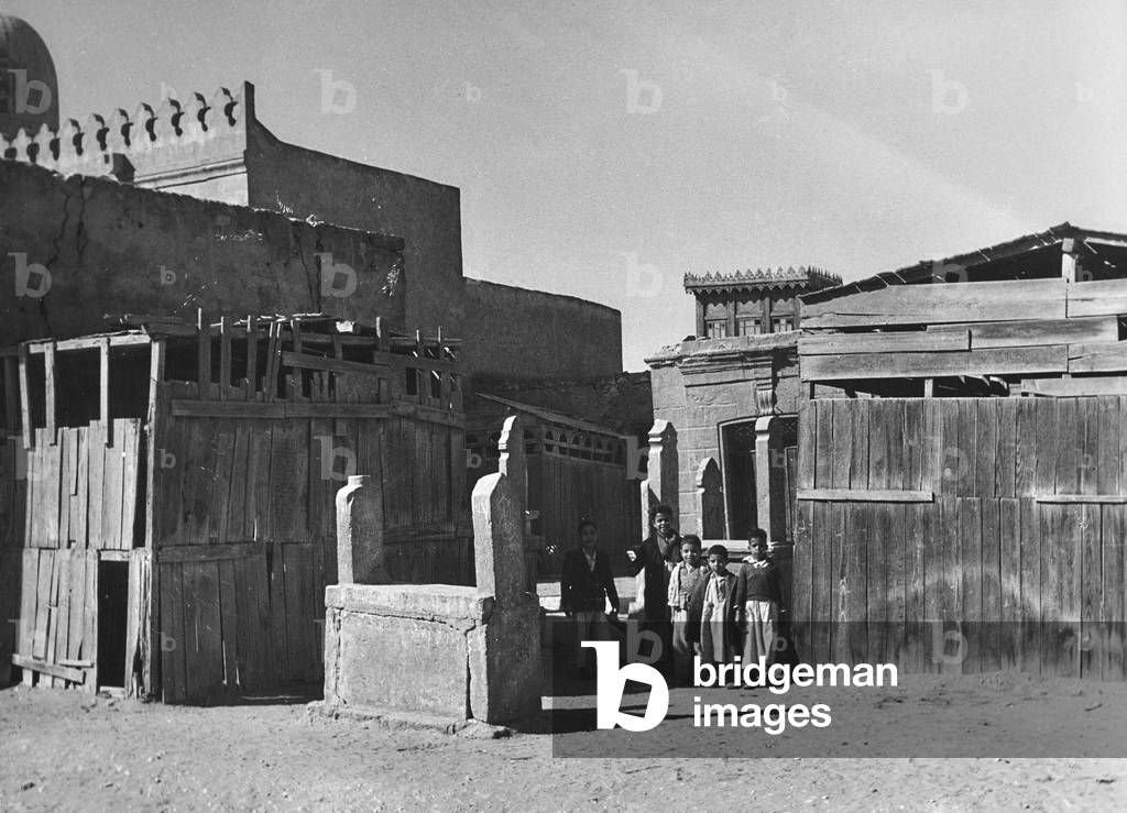 Children in the Muslim cemetery Al-City of the Dead, known as 