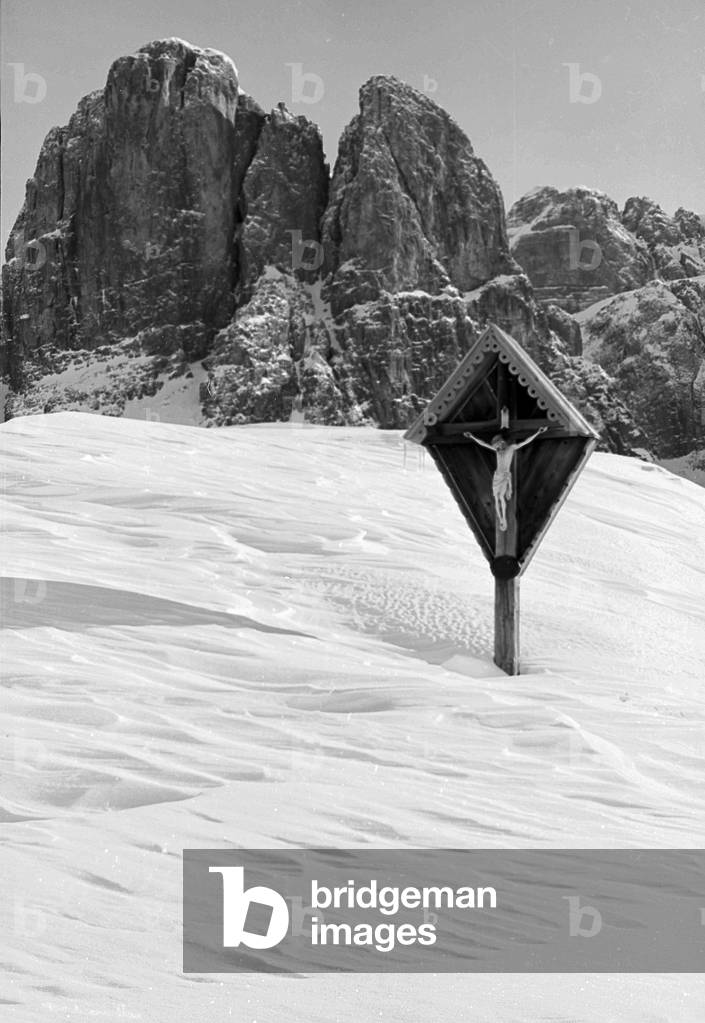 Snowy mountain landscape with crucifix, Cortina d'Ampezzo