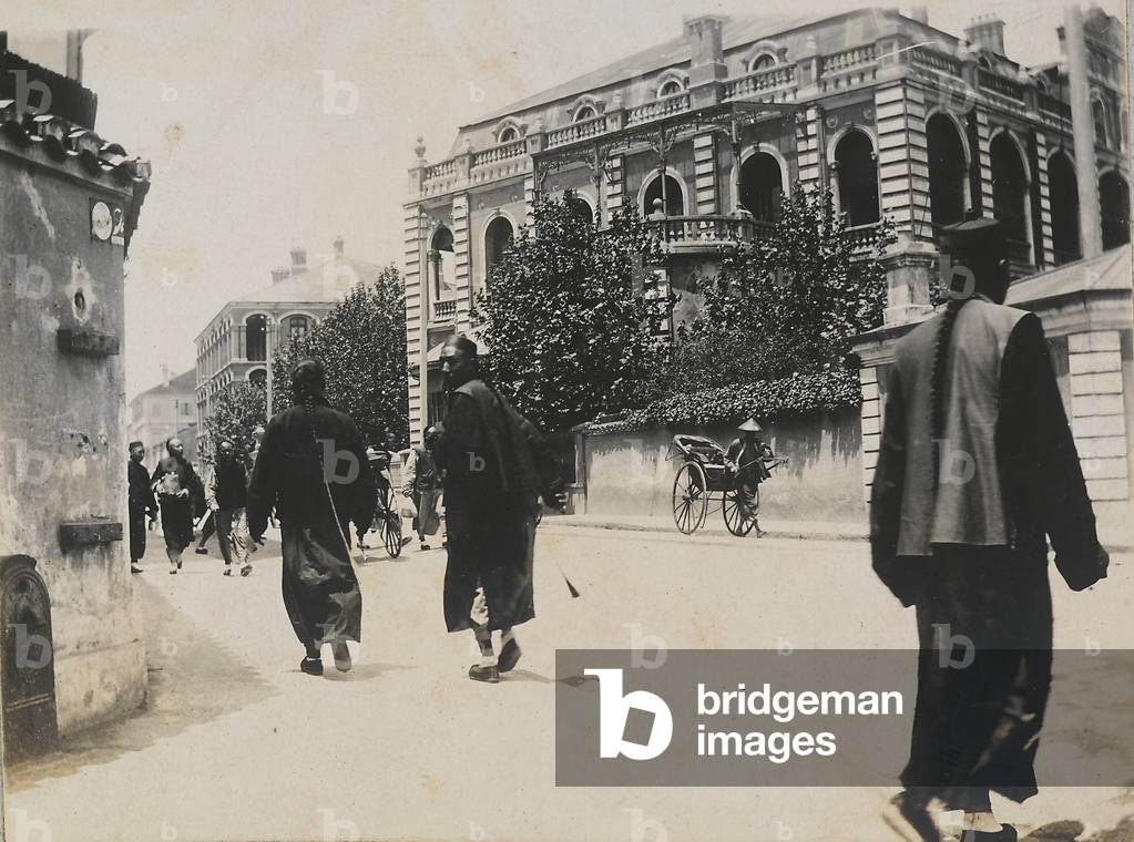 Japanese people wearing traditional clothes as they walk along a street, 1890 (print on double-weight paper)