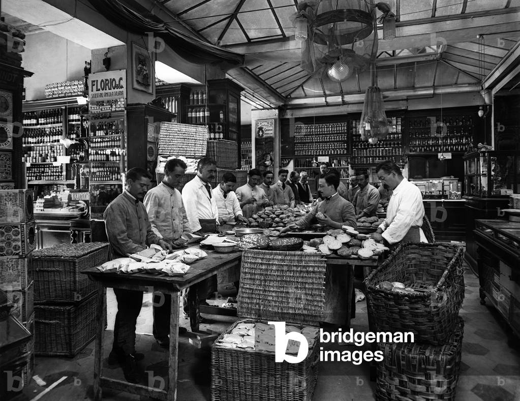 Workers for school meals for the town of Florence: the preparation of sandwiches in a grocery store