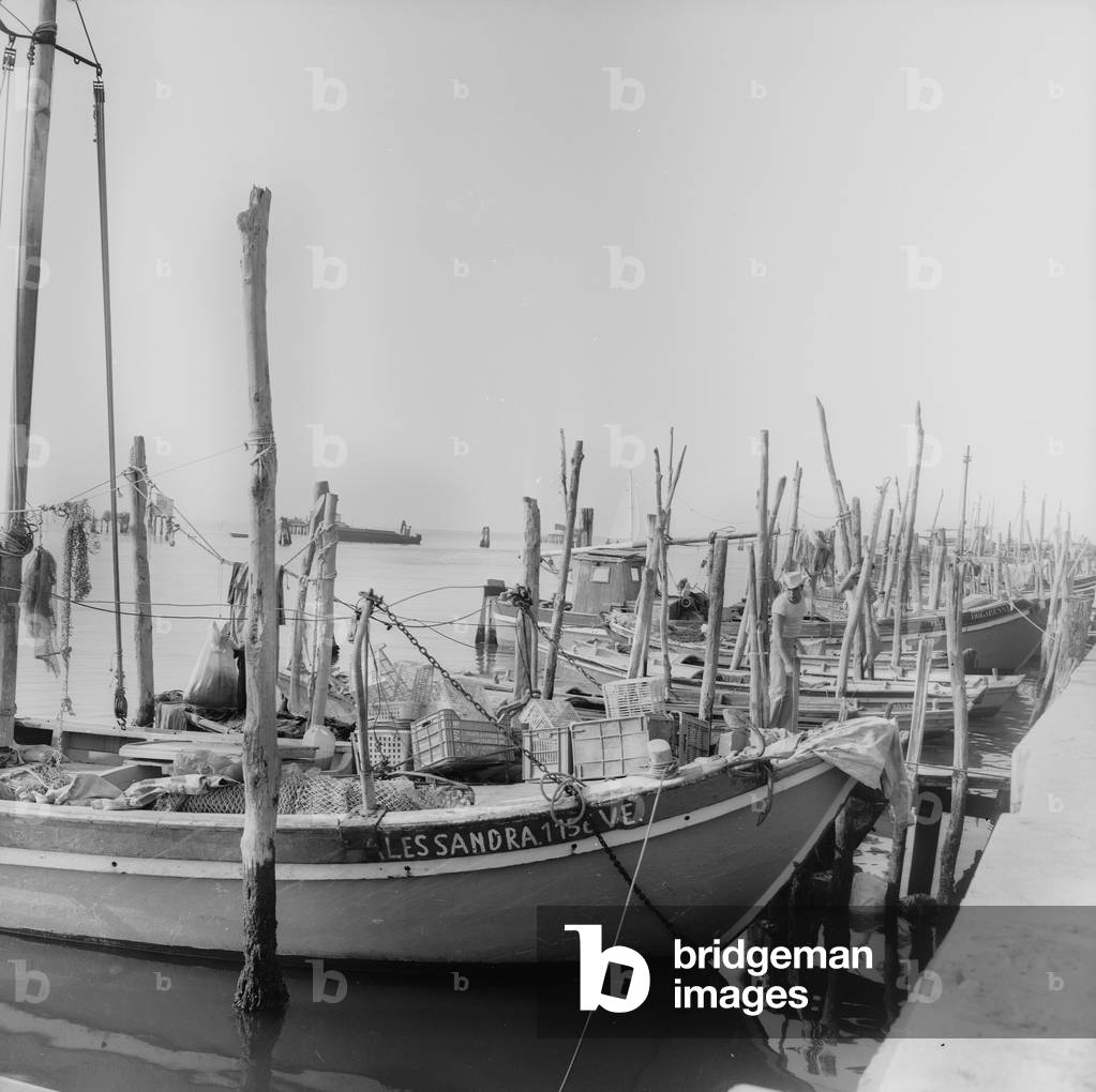 Berthing of boats in Venice (b/w photo)