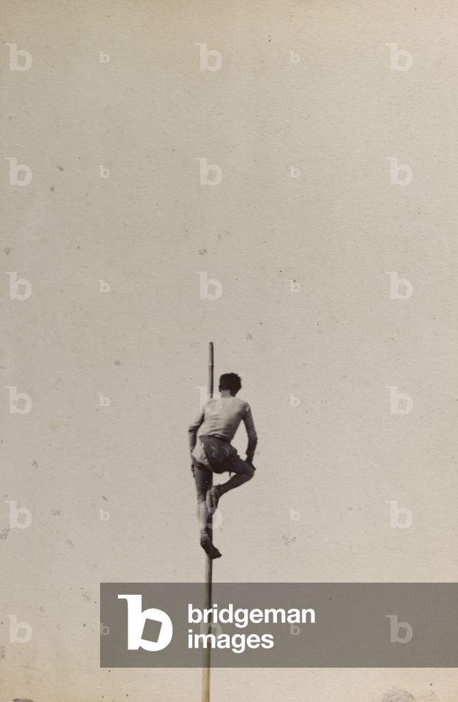 Man climbed up a flagpole of a boat