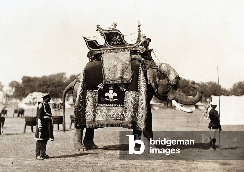 Two Indians next to an elephant, which was dressed up for the occasion of the parade in honor of the Prince of Wales, 1864 (print on double-weight paper)