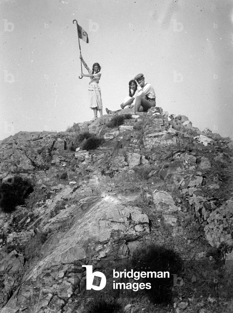 Group of kids on a rock on the Island of Elba
