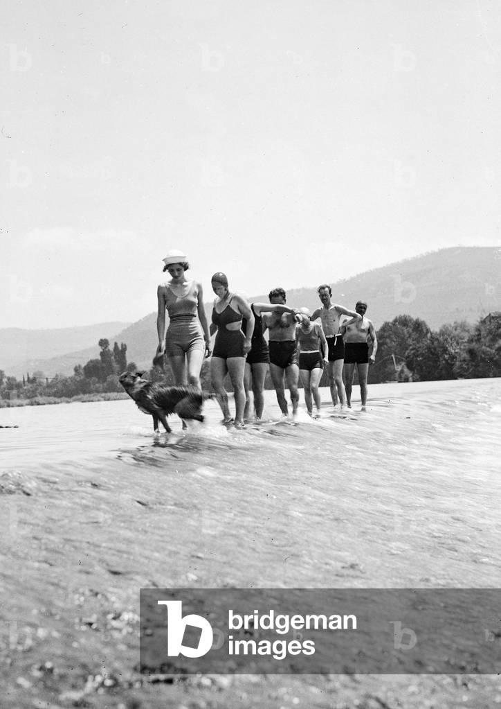 Group in a bathing suit in the waters of a river