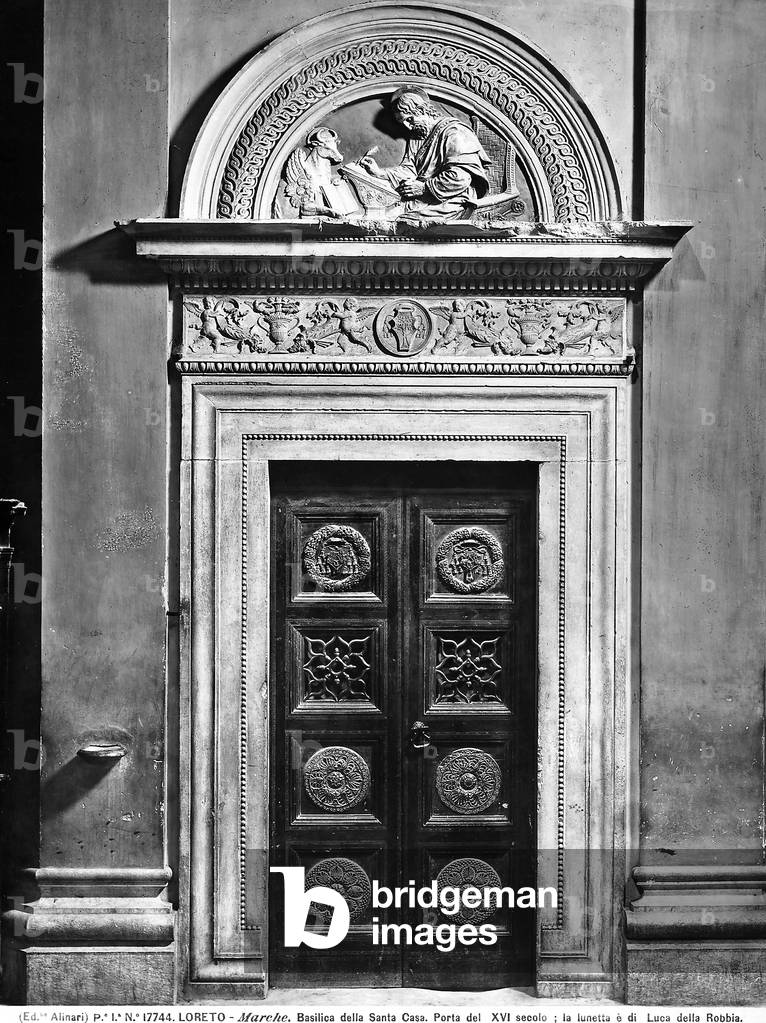 Door of the Sacresty of S.Luca with above lunette in the style of Della Robbia in terracotta, representing the Evangelist S.Luca , in the Sanctuary of the Santa Casa in Loreto