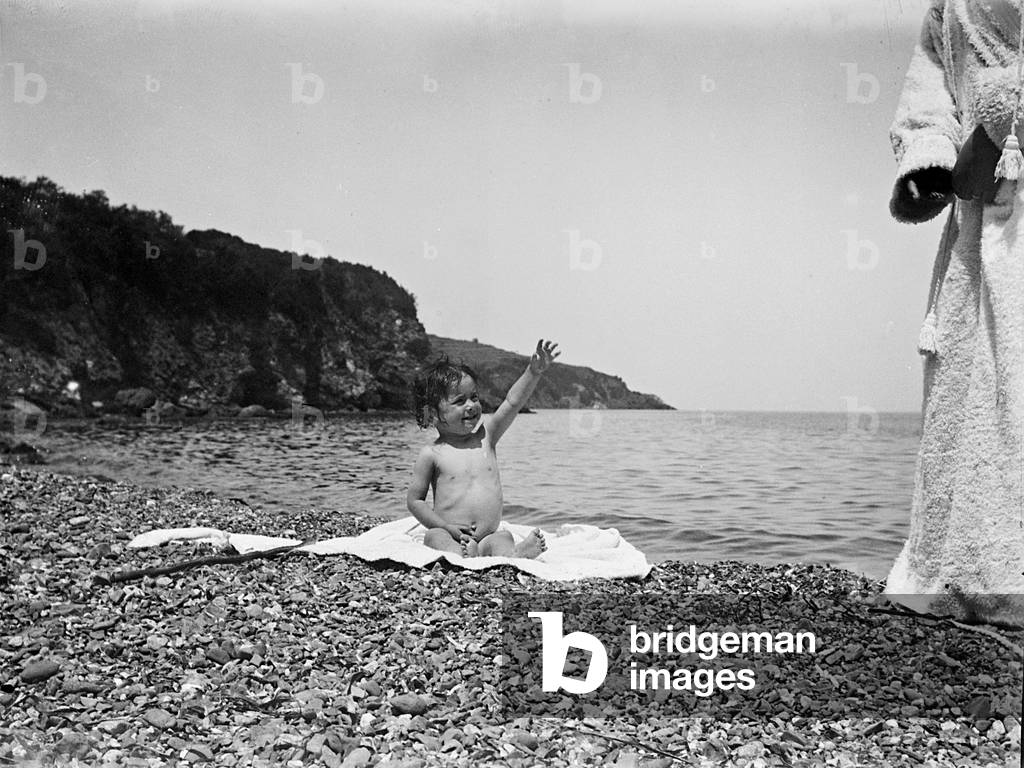 A child playing by the sea