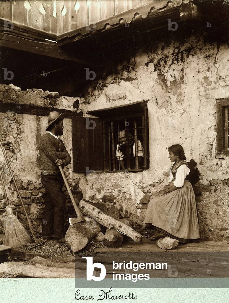 Three people photographed at Casa Maierotto, Cortina