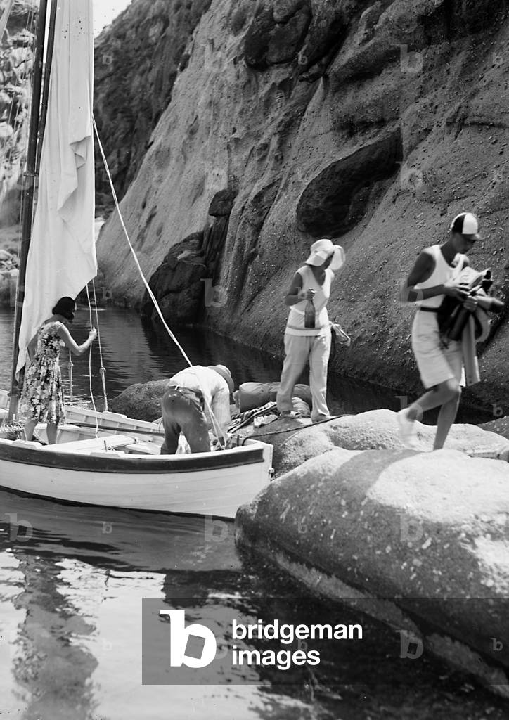 Group of tourists with its own boat dock in a cove of the Elba island