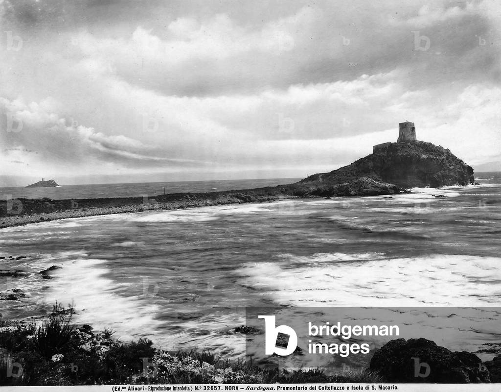 View of the Promontory of Coltellazzo on the outskirts of Nora, Sardinia. On the point of the Promontory is an observation tower, built by the Spanish at the end of the XVI century. The island of S. Macario is visible on the horizon.