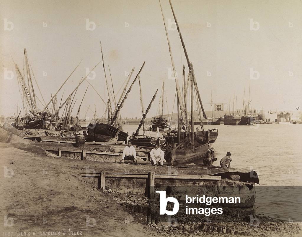 Boats docked at the wharf of the Suez