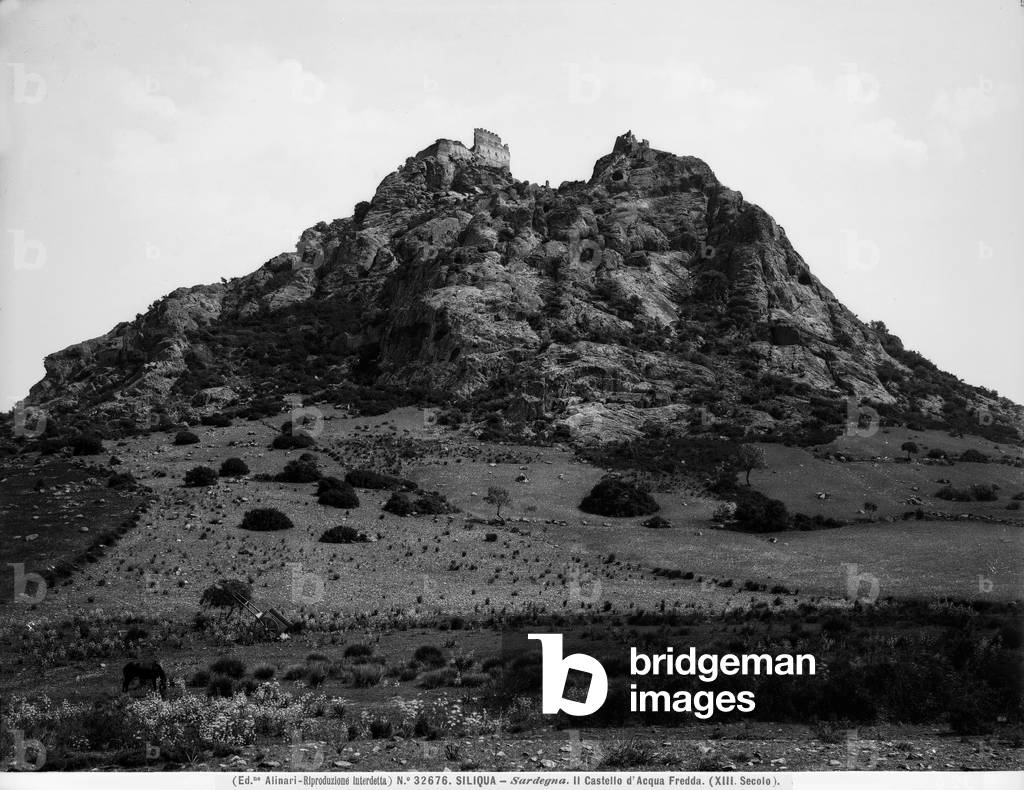 View of the Silìqua lava hill, Sardinia. The remains of the Acquafredda Castle are visible at the peak.
