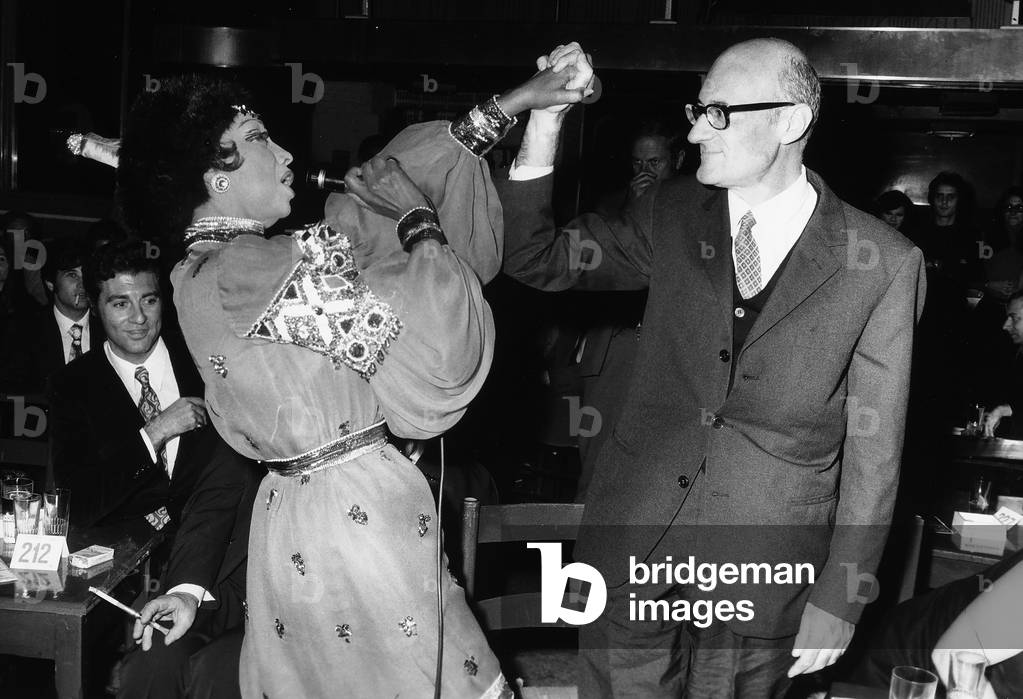 The singer Joséphine Baker performing while dancing with a man from the audience