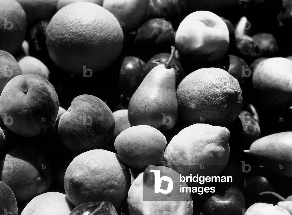 Close up of lemons, apricots, peaches, oranges and plums (b/w photo)