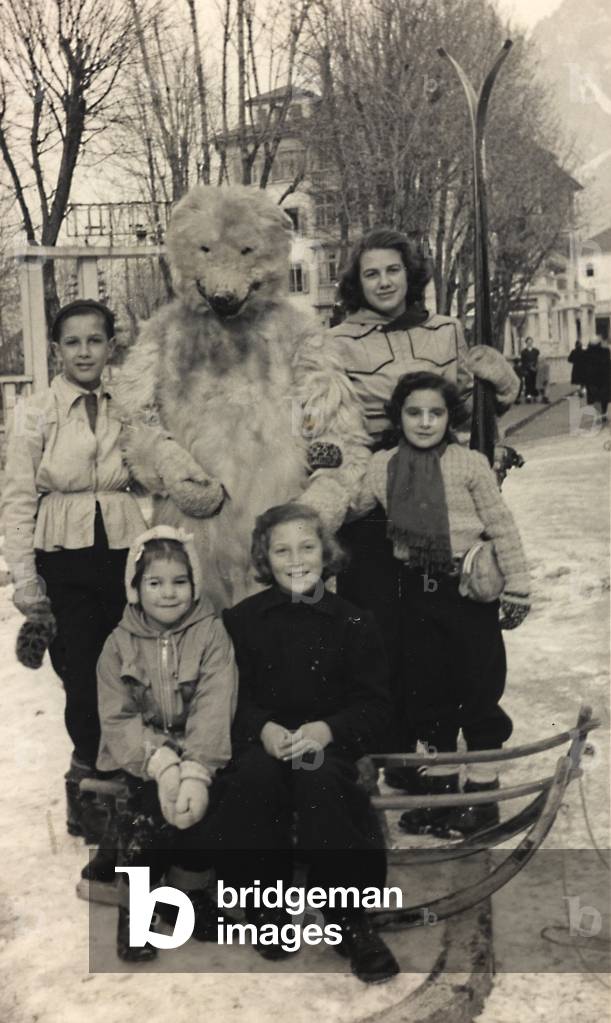 Group portrait with a white bear, symbol of Cortina d'Ampezzo, Belluno
