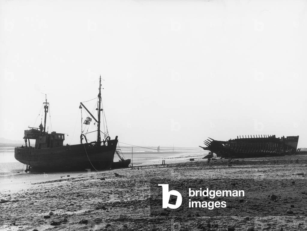 Wrecks of boats on the beach of Etaples, July 1963 (b/w photo)