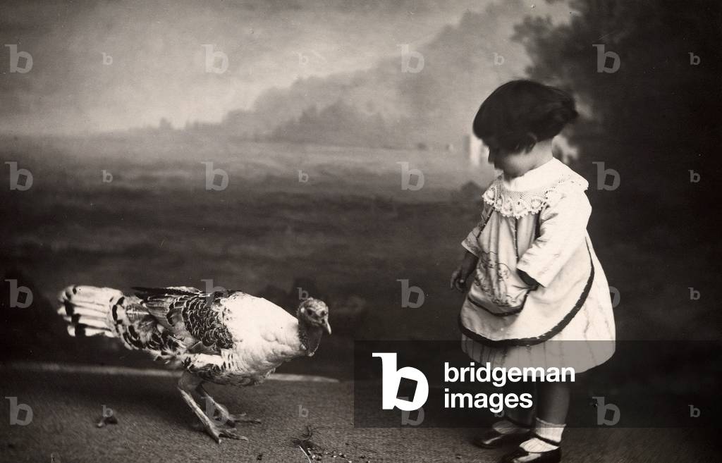 Baby girl with a turkey