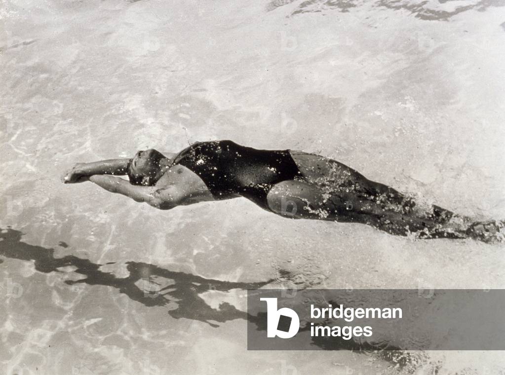 Swimmer doing the backstroke (b/w photo)